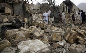 Onlookers at the site of one of a series of Taliban attacks against civilians in the spring of 2013 on the eve of the country’s parliamentary elections. (Credit: Human Rights Watch).